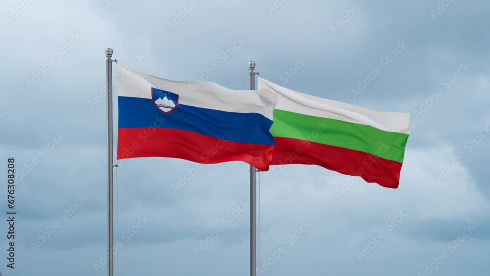 Bulgaria flag and Slovenia flag waving together on cloudy sky, endless seamless loop, two country relations concept Bulgaria flag and Slovenia flag waving together on cloudy sky, endless seamless loop, two country relations concept