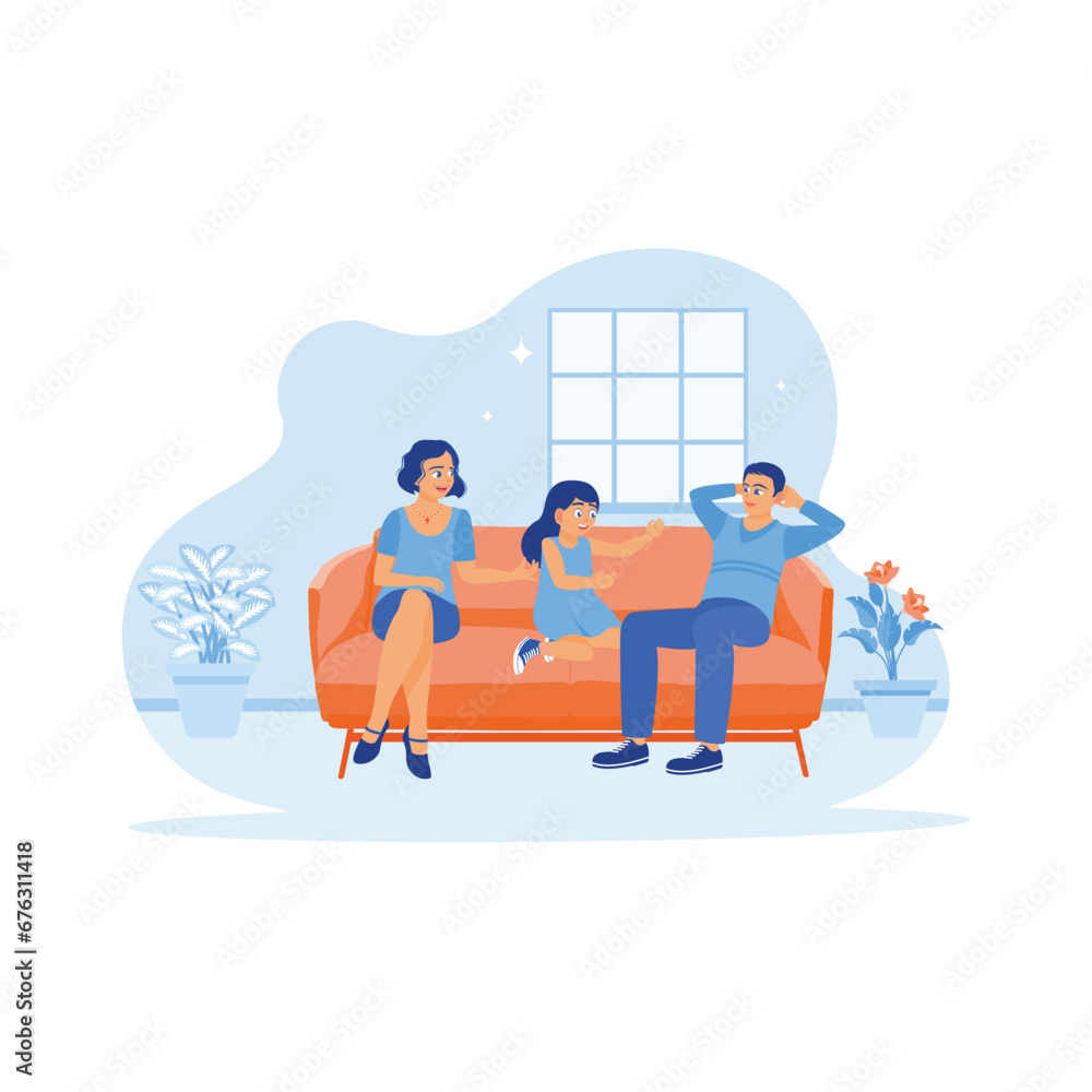 Happy little family sitting together on the sofa. The little girl is thrilled playing with her parents at home on the weekend. A couple of sunny, funny parents concepts. 