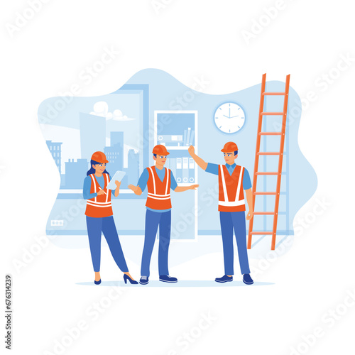 Engineers and architects work in the interior construction process of a house. Using a digital tablet to record information when inspecting construction work. Discuss Information concept. 