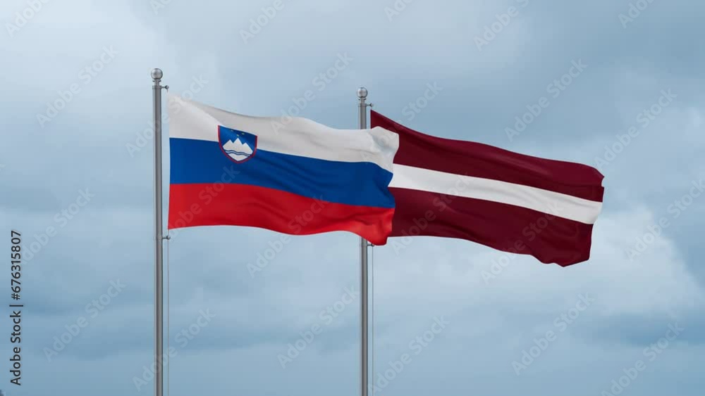 Latvia and Slovenia flag waving together on cloudy sky, endless seamless loop, two country cooperation concept Latvia and Slovenia flag waving together on cloudy sky, endless seamless loop, two country cooperation concept