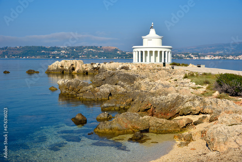 View of Saint Theodore lighthouse in Argostoli on Kefalonia, the largest of the Ionian island, Greece, Europe. Concept of tourism and travel. photo