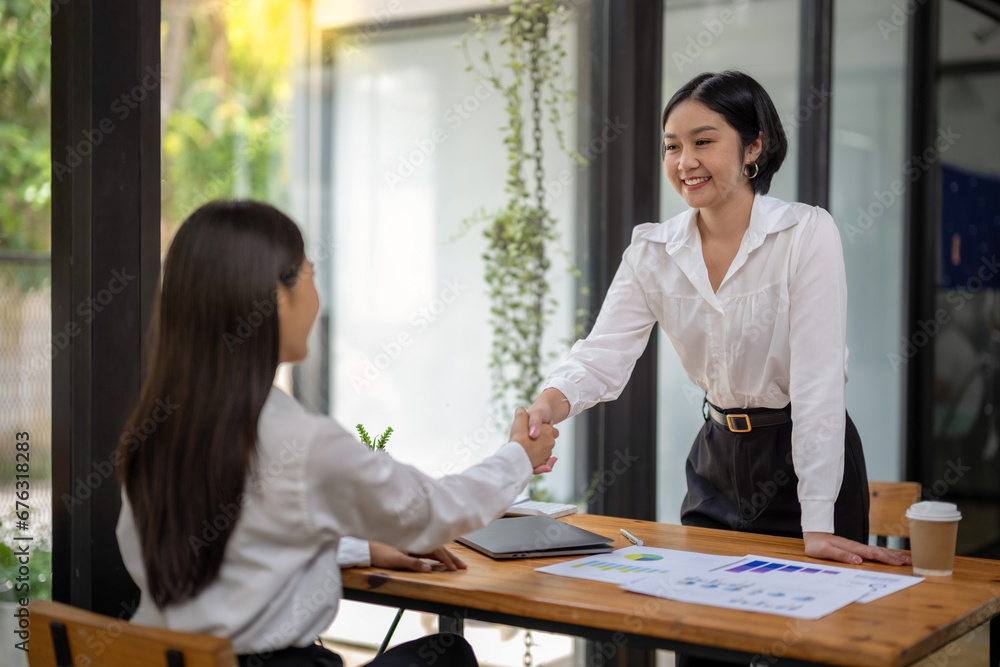 Businesswoman shaking hands during a meeting success, dealing, greeting and partner concept. Businesswoman shaking hands during a meeting success, dealing, greeting and partner concept.