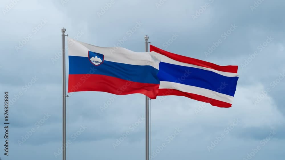 Kingdom of Thailand and Slovenia flag waving together on cloudy sky, endless seamless loop, two country cooperation concept Kingdom of Thailand and Slovenia flag waving together on cloudy sky, endless seamless loop, two country cooperation concept