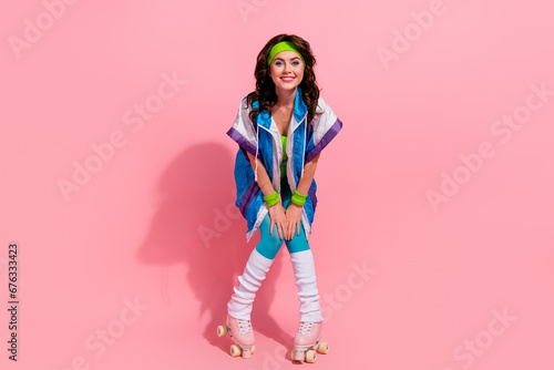 Photo of funny sportive trainer lady online blogging teach riding roller skates isolated on pastel color background