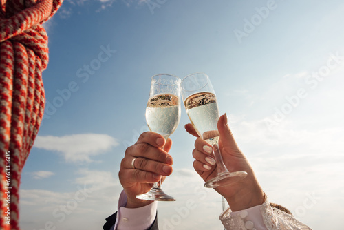 newlyweds holding glasses of champagne