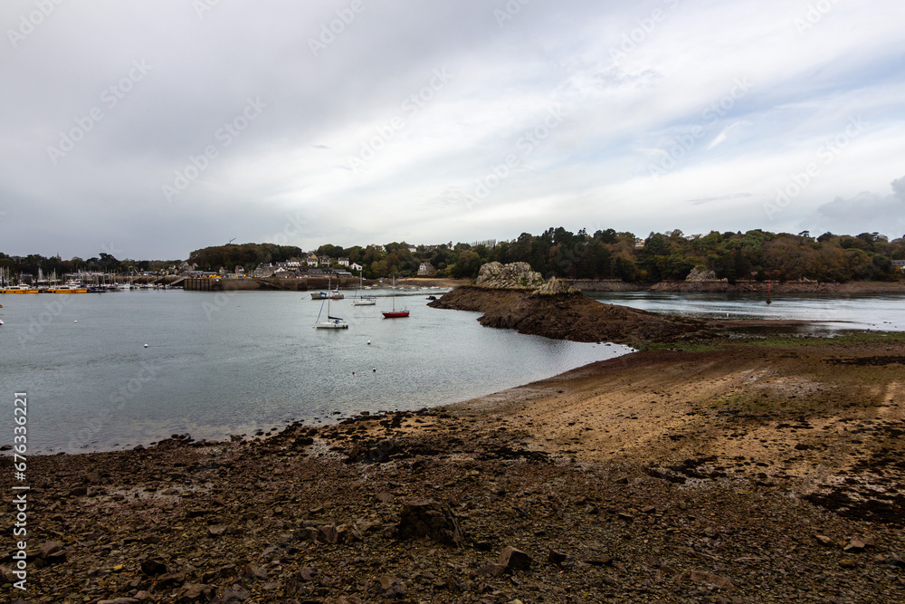 Trieux River with a big rock at the Port of Lezardrieux at low tide, Brittany, France