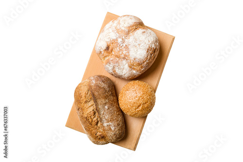 Freshly baked bread on cutting board isolated on white background . top view bread with copy space
