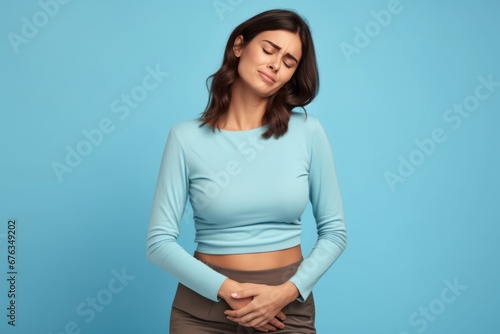 Woman suffering from abdominal pain. Woman stomach ache. Woman touching his stomach. Stomach pain and others stomach disease concept.