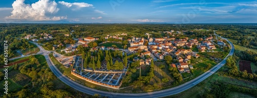 Drone panorama of the Istrian village of Svetvincenat with medieval castle in evening light photo