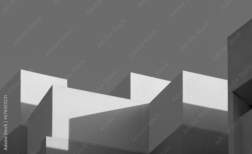 Modern house Building with Sunlight and Shadow on concrete wall surface in Perspective low angle view, Geometric Architecture background in Minimal with Black and White style Modern house Building with Sunlight and Shadow on concrete wall surface in Perspective low angle view, Geometric Architecture background in Minimal with Black and White style