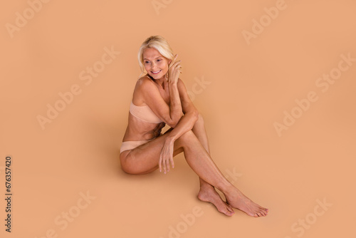 Photo of attractive pretty retired lady self love accept her body enjoying spa salon offer isolated pastel color background