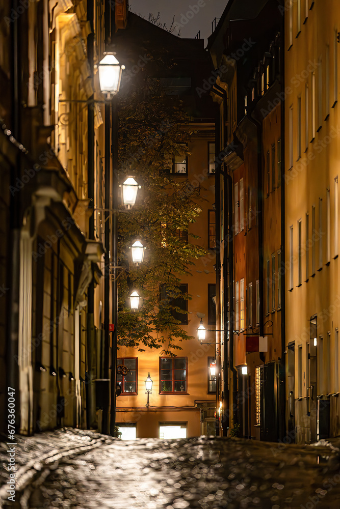 Stockholm, Sweden A cobblestone street in Gamla Stan or Old Town called Sjalagardsgatan.