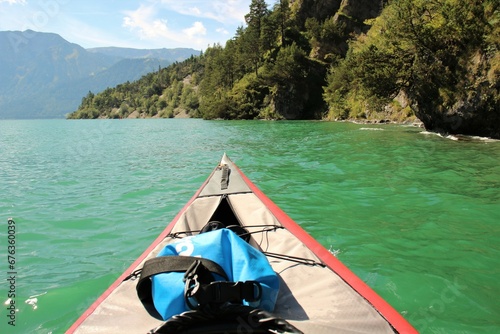 first person view kayaking on a lake in the alps