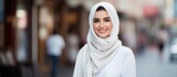 In Dubai s vibrant streets a beautiful woman with a white fashion concept captured the attention of people with her cute smile and happy face showcasing the beauty of her portrait against a