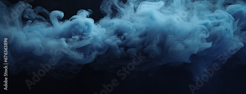 Blue fog on the floor. Dark scene with blue smoke.