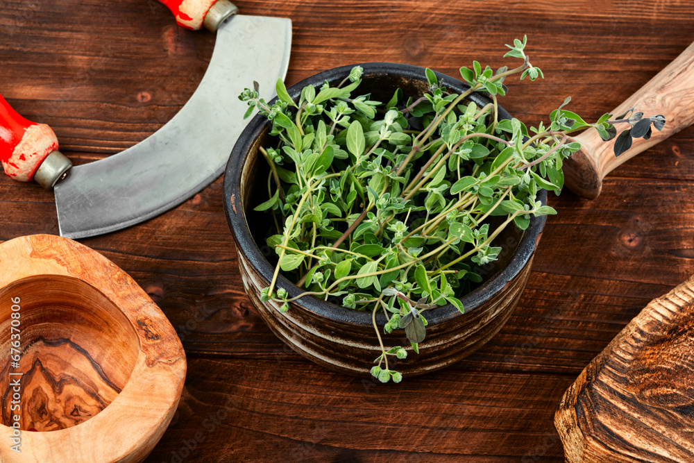 Fresh marjoram leaves on the table. Fresh marjoram leaves on the table.