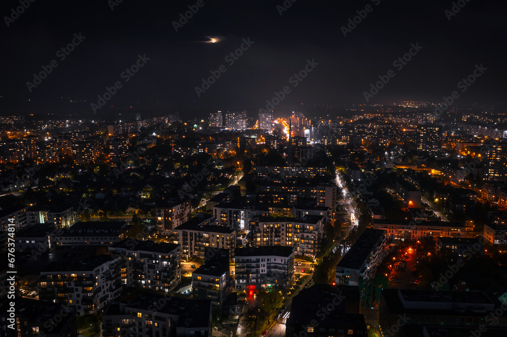 Aerial cityscape of Gdansk Przymorze with the Baltic Sea view at night, Poland.