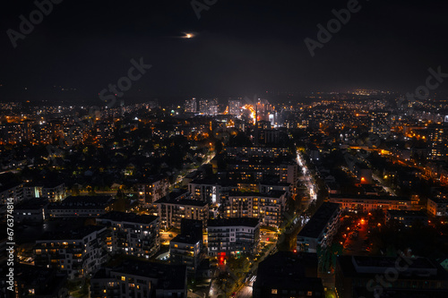 Aerial cityscape of Gdansk Przymorze with the Baltic Sea view at night, Poland.