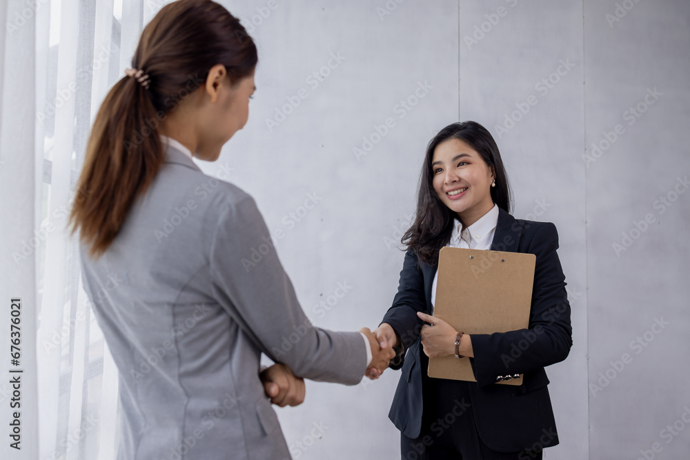 Business asian women handshake and business people. Successful business concept. Business asian women handshake and business people. Successful business concept.
