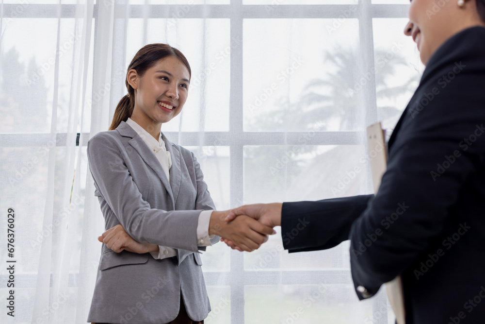 Business asian women handshake and business people. Successful business concept.