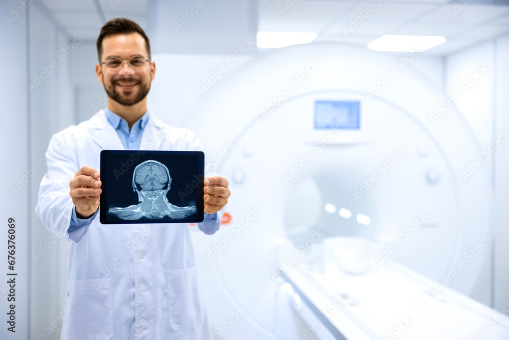Portrait of expert radiologist holding X-ray image of brain inside MRI diagnostic center. Portrait of expert radiologist holding X-ray image of brain inside MRI diagnostic center.
