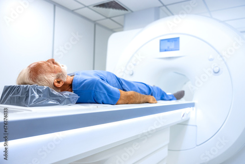 MRI hospital diagnostic center with patient laying down ready for full body scan examination. photo