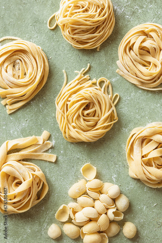 Variety of fresh raw uncooked homemade pasta.