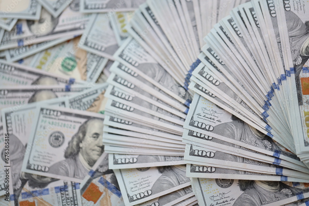 Very big amount of US hundred dollar bills close up. Huge quantity of united states currency notes on flat table Very big amount of US hundred dollar bills close up. Huge quantity of united states currency notes on flat table
