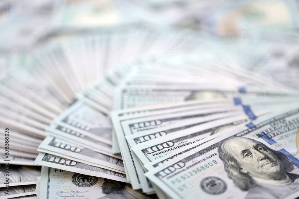 Very big amount of US hundred dollar bills close up. Huge quantity of united states currency notes on flat table Very big amount of US hundred dollar bills close up. Huge quantity of united states currency notes on flat table
