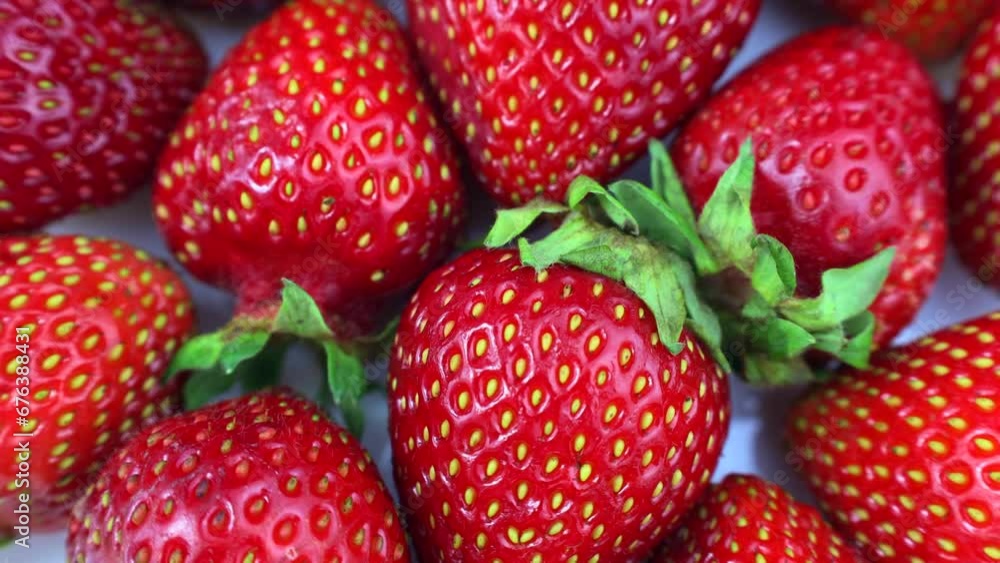 Bright red fresh juicy strawberry berries circle rotation close up top view Bright red fresh juicy strawberry berries circle rotation close up top view