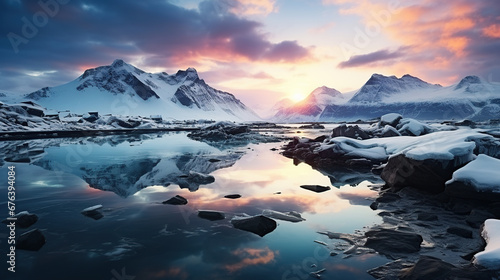 View of rocky mountains covered with snow near frozen lake under cloudy sunset sky in iceland 