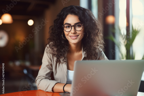 Portrait of a beautiful confident businesswoman using a laptop computer