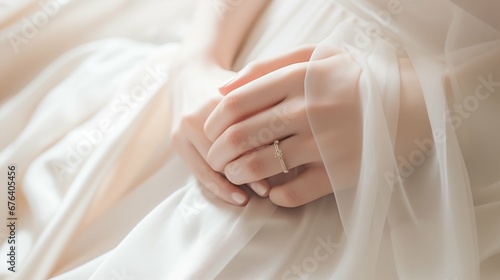 Wedding ring on woman finger, closed up hand photo