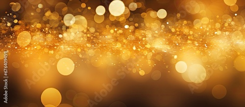 The abstract background design features a golden texture with scattered bokeh lights in yellow creating a bright and vibrant color scheme The blur effect adds a touch of subtle elegance res photo