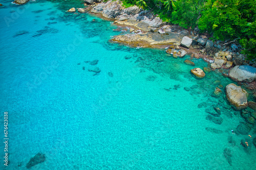  Drone photography of tourist snorkelling, granite rocks, turquoise and transparent water, near the shore, sunset beach, Mahe, Seychelles 1.