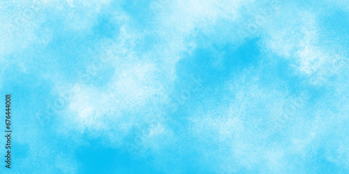 Hand painted blue sky and clouds with watercolor shaded texture, Sky clouds with brush painted blue watercolor texture, small and large clouds alternating and moving slowly on cloudy winter sky.