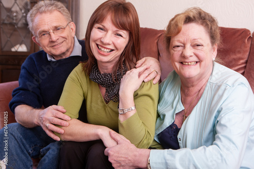 Help the Aged: Family Portrait. A friendly and casual portrait of a mature woman and her aging parents. From a series of related images.