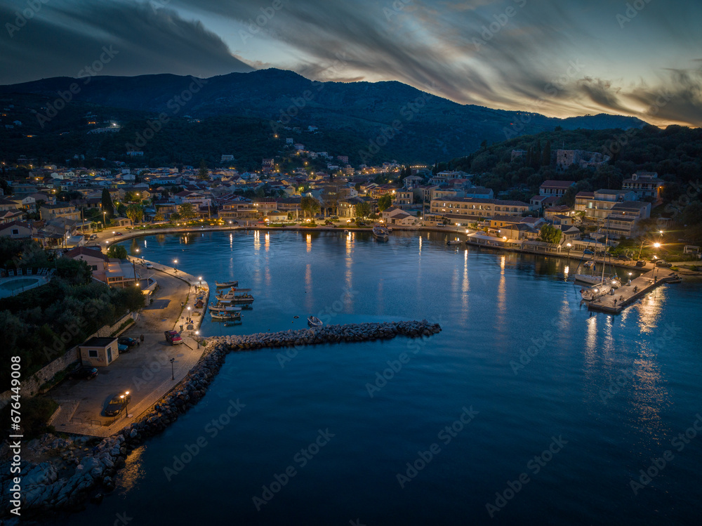 Drone view of beautiful Kassiopi bay by night