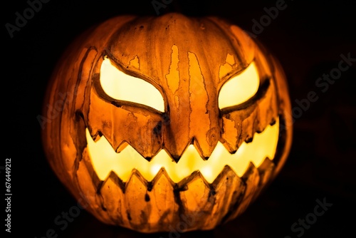 Scary Halloween pumpkin on dark background