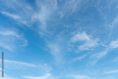 Beautiful blue sky with strange shape of clouds in the morning or evening used as natural background texture in decorative art work.