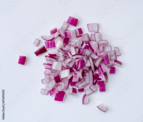 Photography Red or purple onion chopped into small pieces in stack or pile isolated on white background