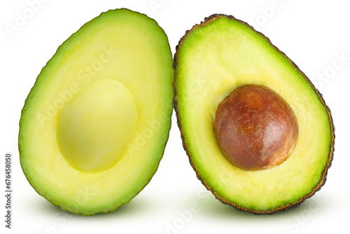 Cut avocados, with and without pits, facing each other, on an isolated white background.