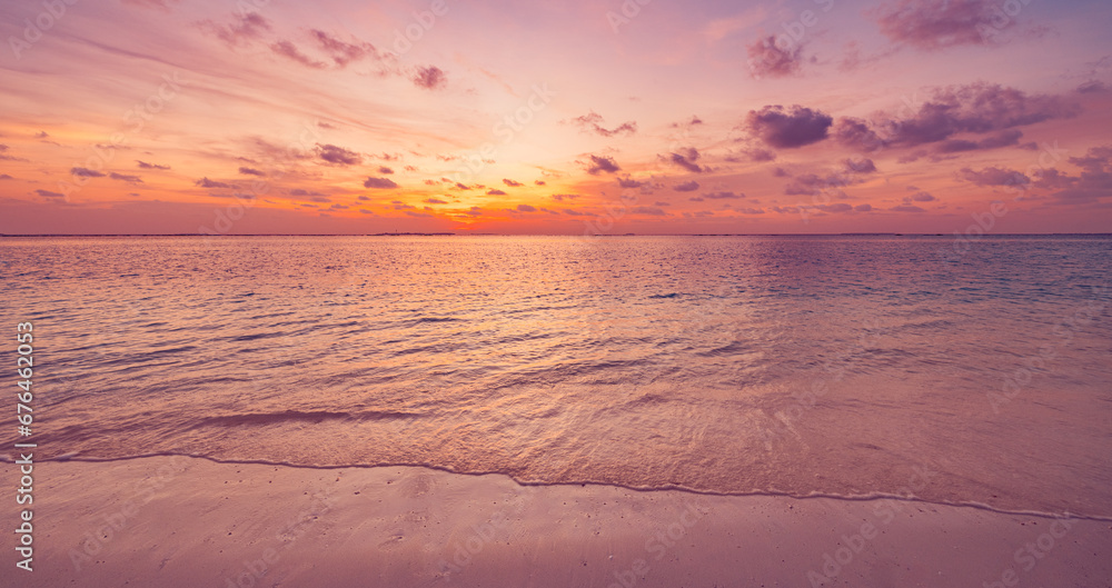 Closeup sea waves beach horizon. Panoramic beach landscape. Paradise tropical beach summer seascape. Colorful sunset sky, soft sand, calmness, tranquil relaxing sunlight. Inspire meditation vacation