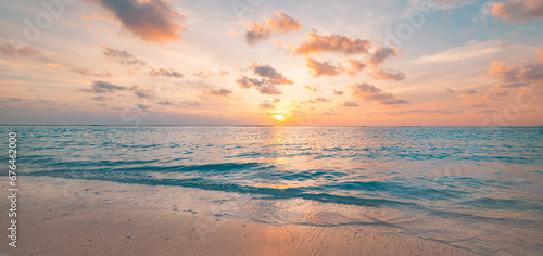 Closeup sea waves beach horizon. Panoramic beach landscape. Paradise tropical beach summer seascape. Colorful sunset sky, soft sand, calmness, tranquil relaxing sunlight. Inspire meditation vacation © icemanphotos