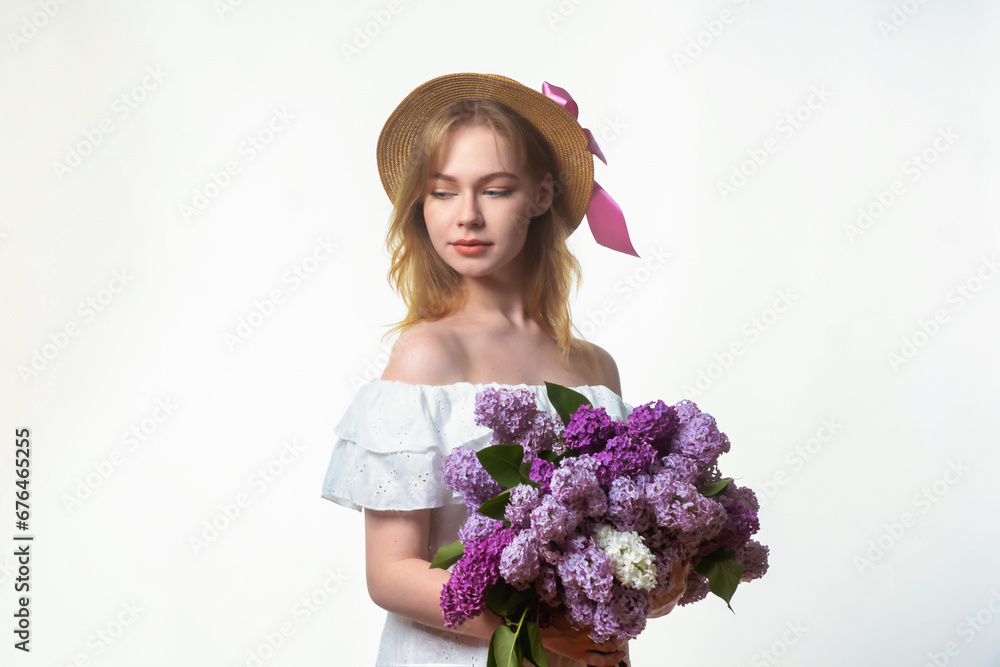 A young, beautiful girl with a large bouquet of lilacs. Vintage style. A young, beautiful girl with a large bouquet of lilacs. Vintage style.