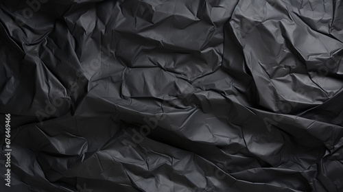 black crumpled paper background © Christopher