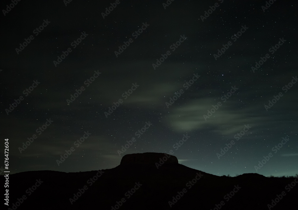 Zoroastrian fortress Chilpyk at night on the mountain against the background of the starry night sky in the desert Zoroastrian fortress Chilpyk at night on the mountain against the background of the starry night sky in the desert