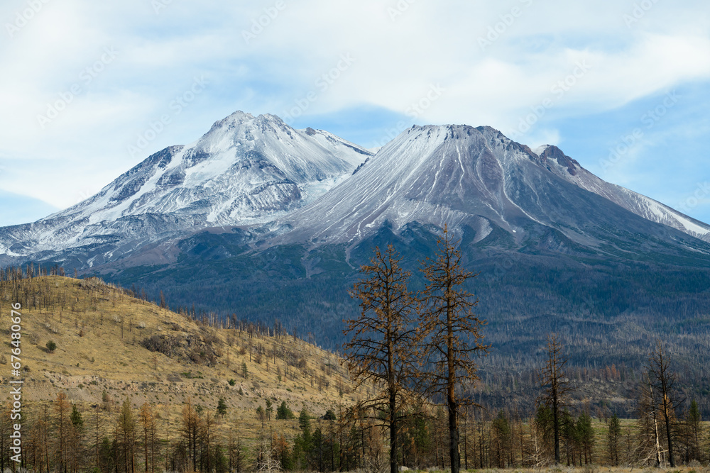 Mount Shasta volcano in Northern California with seasons first snowfall on summit