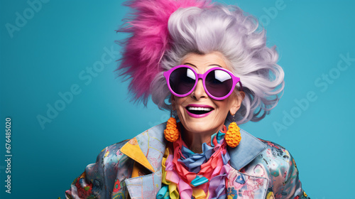 Elderly woman exuding youthful vibes, rocking stylish attire, presented in a bright, multi-hued background.
