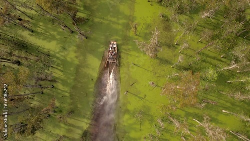 Aerial Top Forward Shot Of Airboat Moving On Atchafalaya River - Bayou, Louisiana